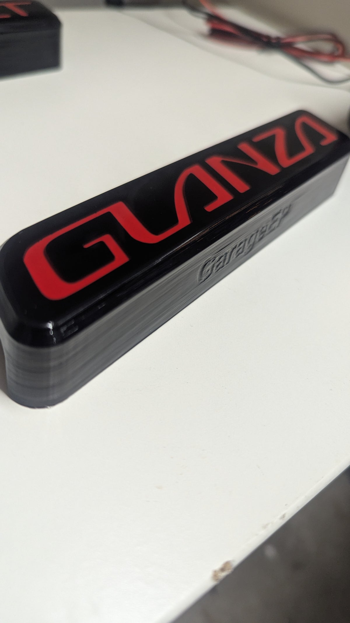 Pre-Facelift Bumper Red Illuminated Glanza Badge