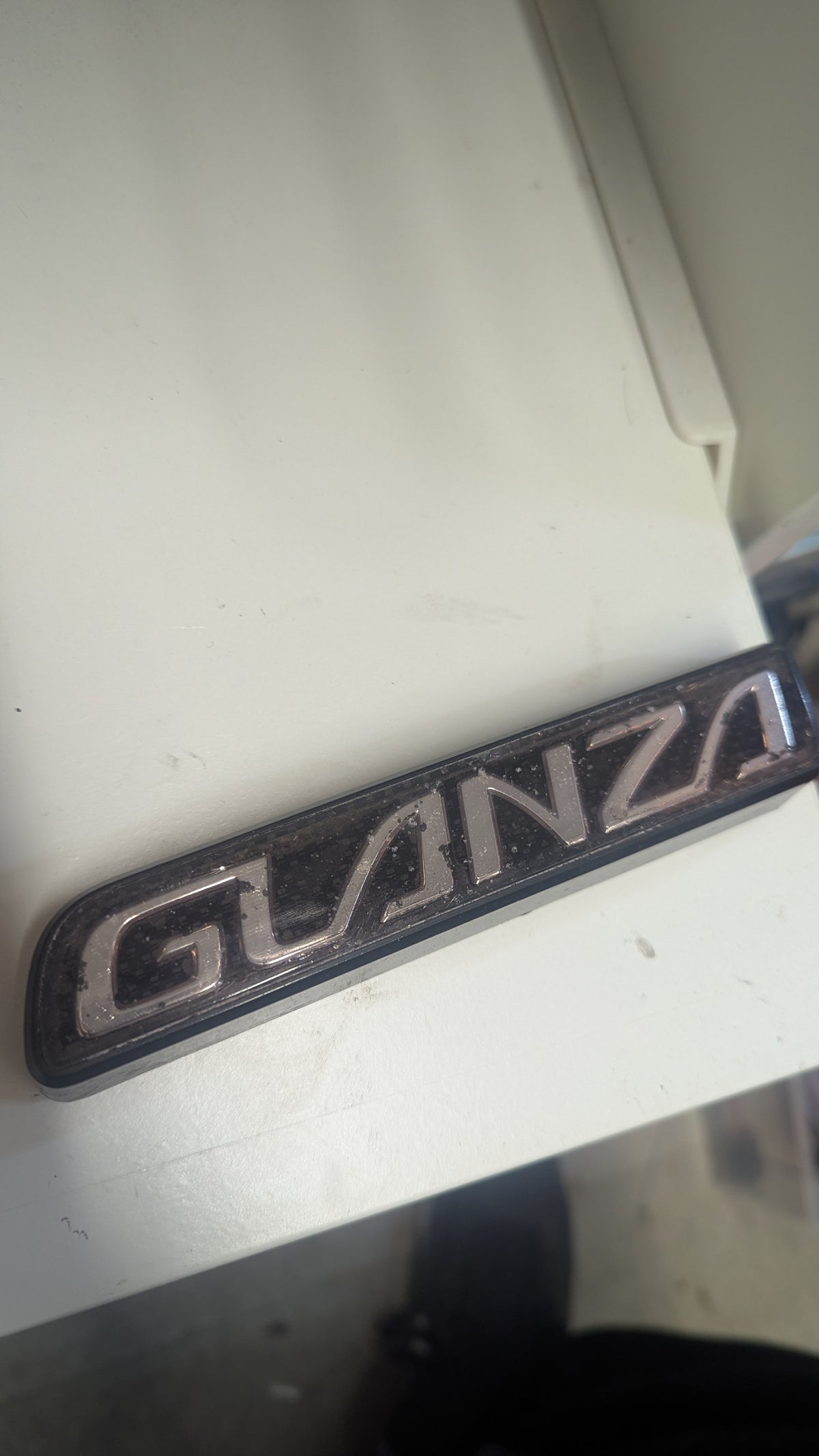 Pre-Facelift Genuine OEM Glanza Badge USED